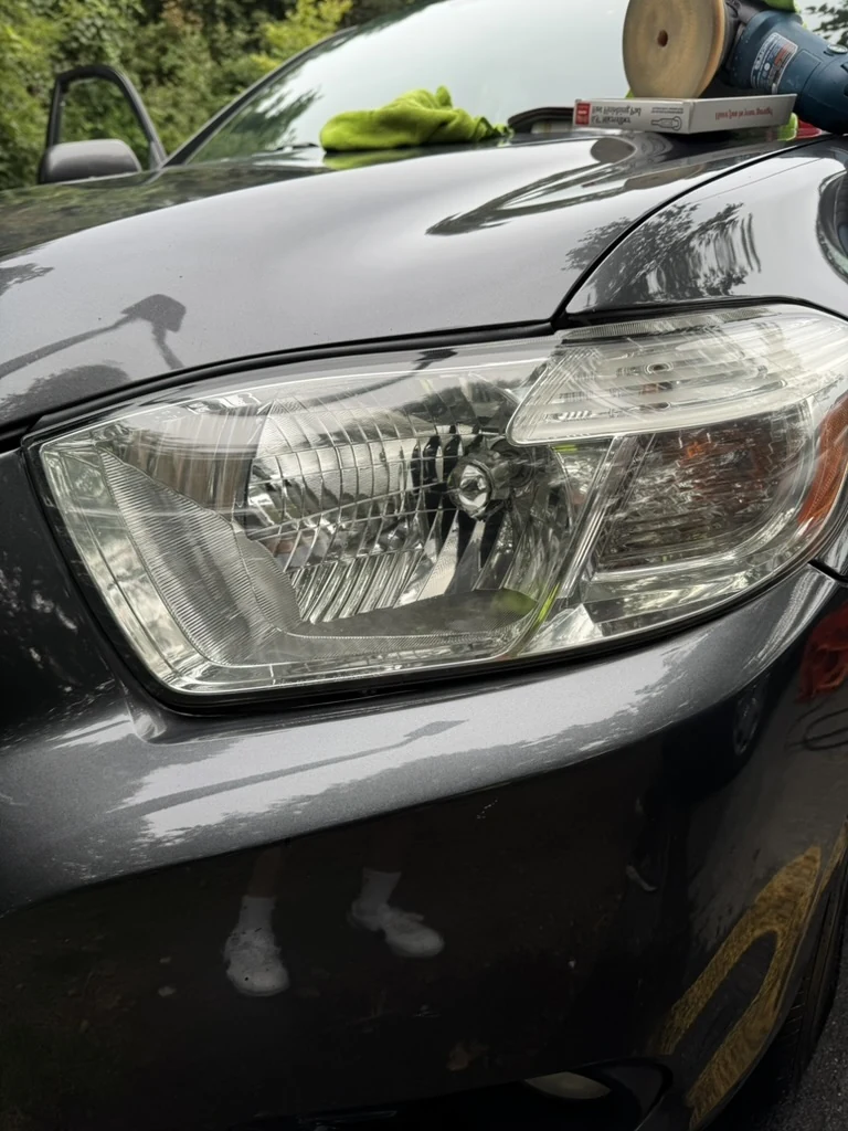 Clear headlight lens with the reflector details visible after restoration